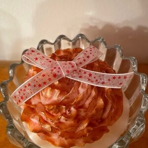 Candles in containers of glassware